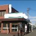 制作例店舗入口の壁面看板暗闇でも目立つスポットライト付き店舗看板と袖看板